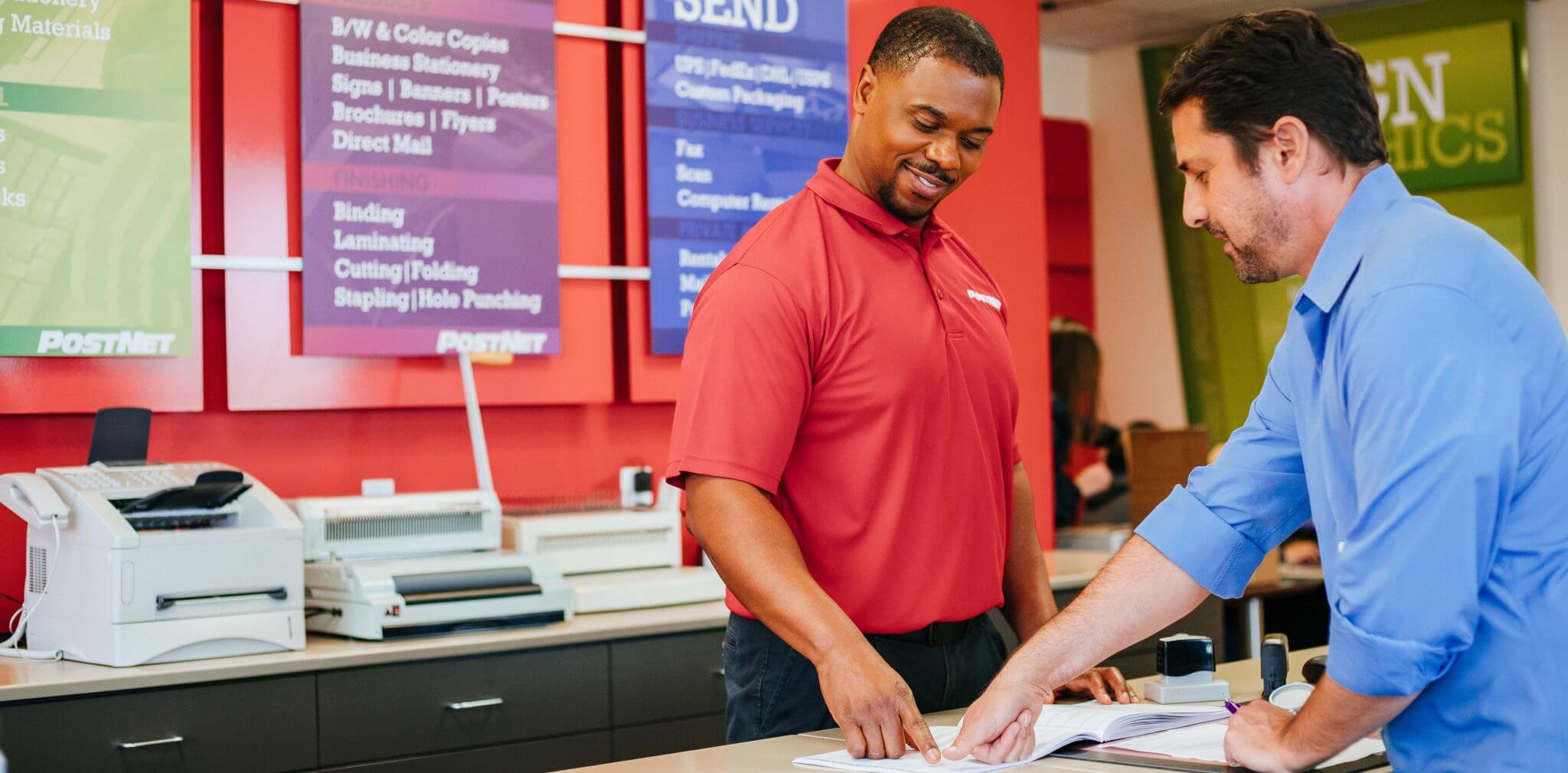 Employee helping customer with printing needs